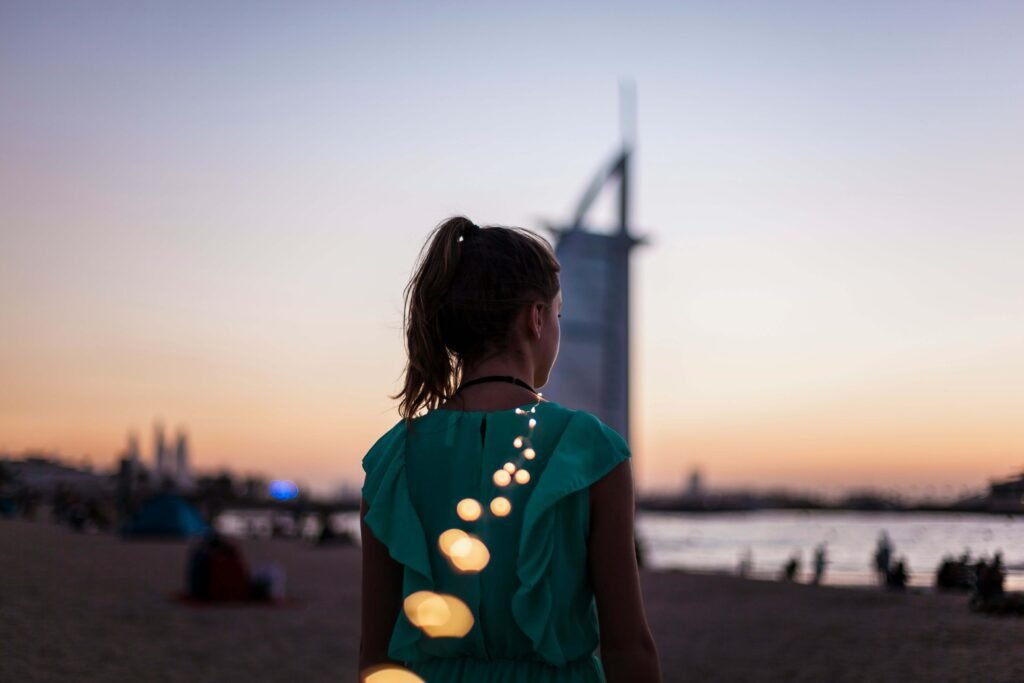 a woman standing on a beach in Dubai